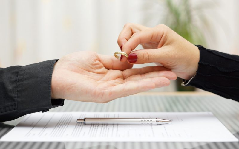 woman returned wedding ring to  husband . Divorce concept